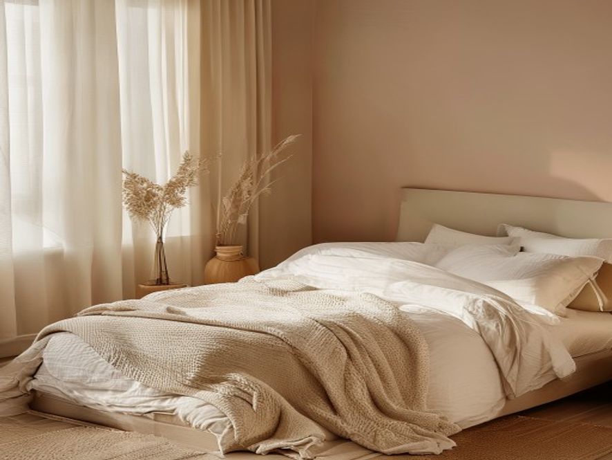 Ideal sleep sanctuary Minimalist bedroom with soft lighting, neutral tones, and comfortable bedding at dusk